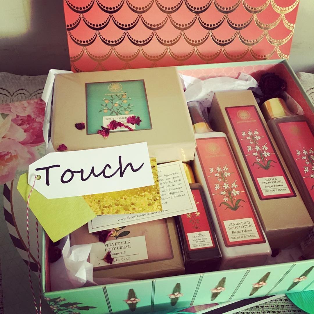 Beauty products in a gift box with a handwritten tag saying Touch