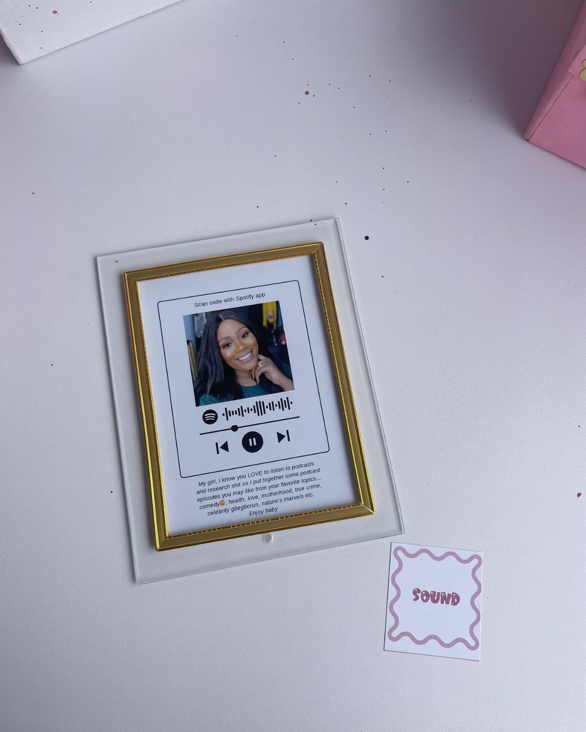 Framed photo with music player graphics and a small card labeled SOUND