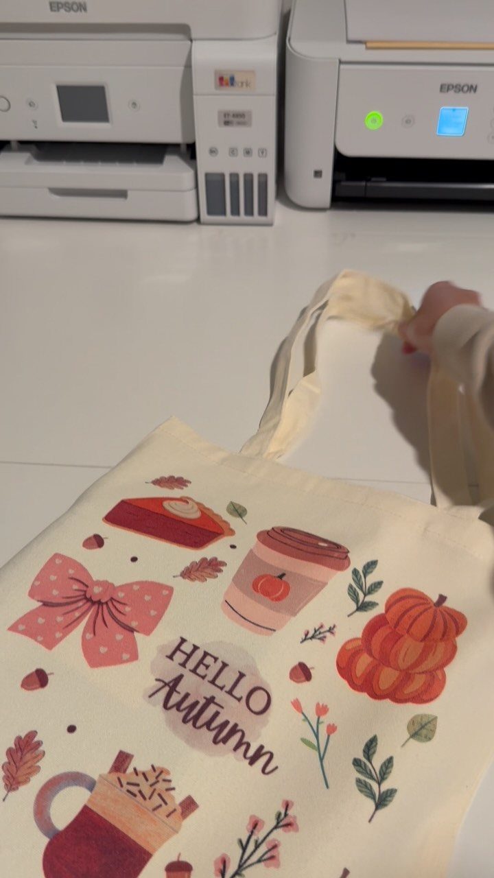 Cream canvas tote bag with autumn illustrations and Hello Autumn text.