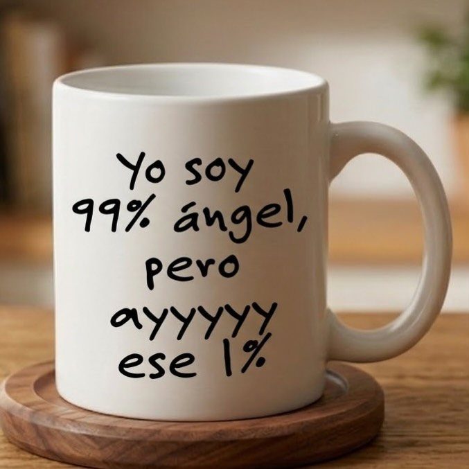 White ceramic coffee mug with humorous Spanish text on a wooden coaster.