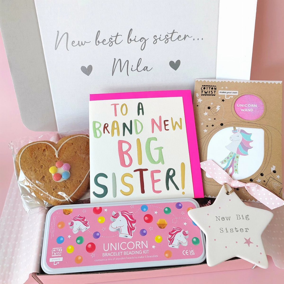 Gift box for a big sister with a bracelet kit, card, and treats.