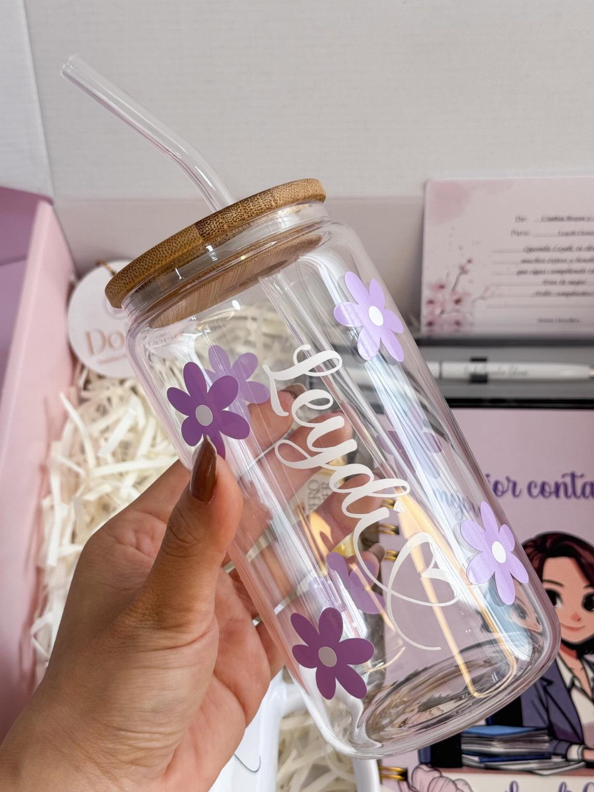 Clear glass tumbler with purple flowers and cursive text in a gift box