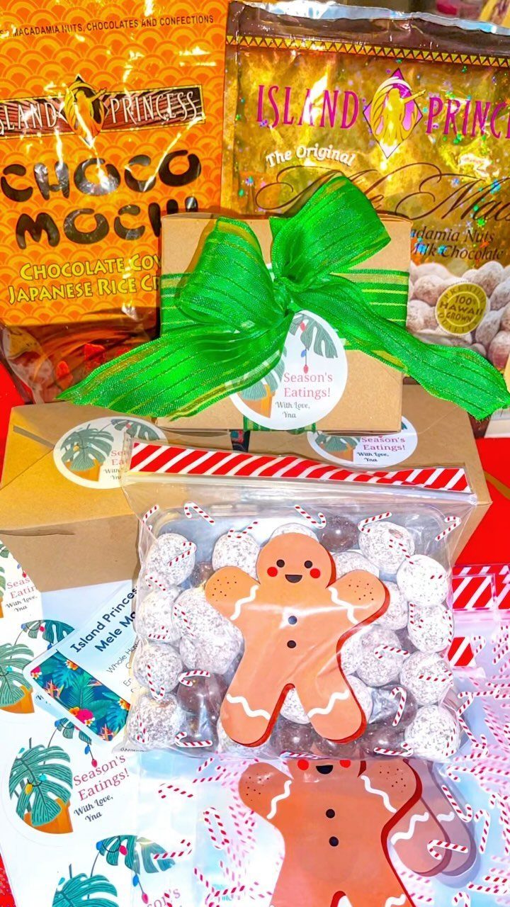 Festive snack gift set with gingerbread cookies, packaged treats, and a green bow.