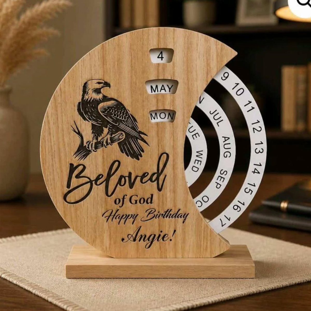 Wooden crescent perpetual calendar with an engraved eagle and personalized birthday message for Angie.