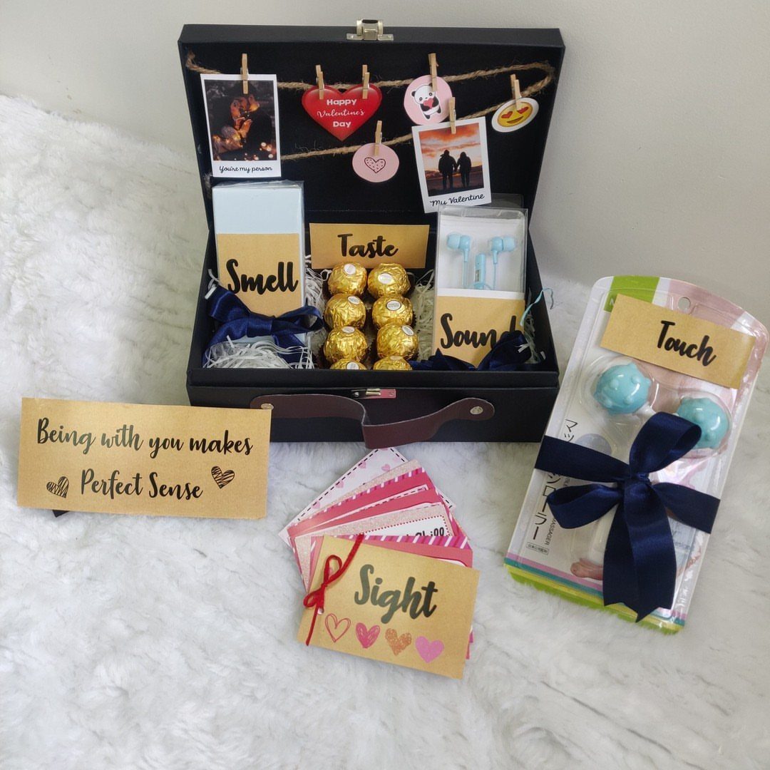 Five senses gift set in a black briefcase with labeled gift items.