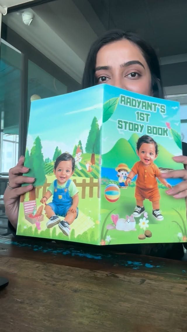 Personalized children's storybook featuring a baby boy held by a woman.