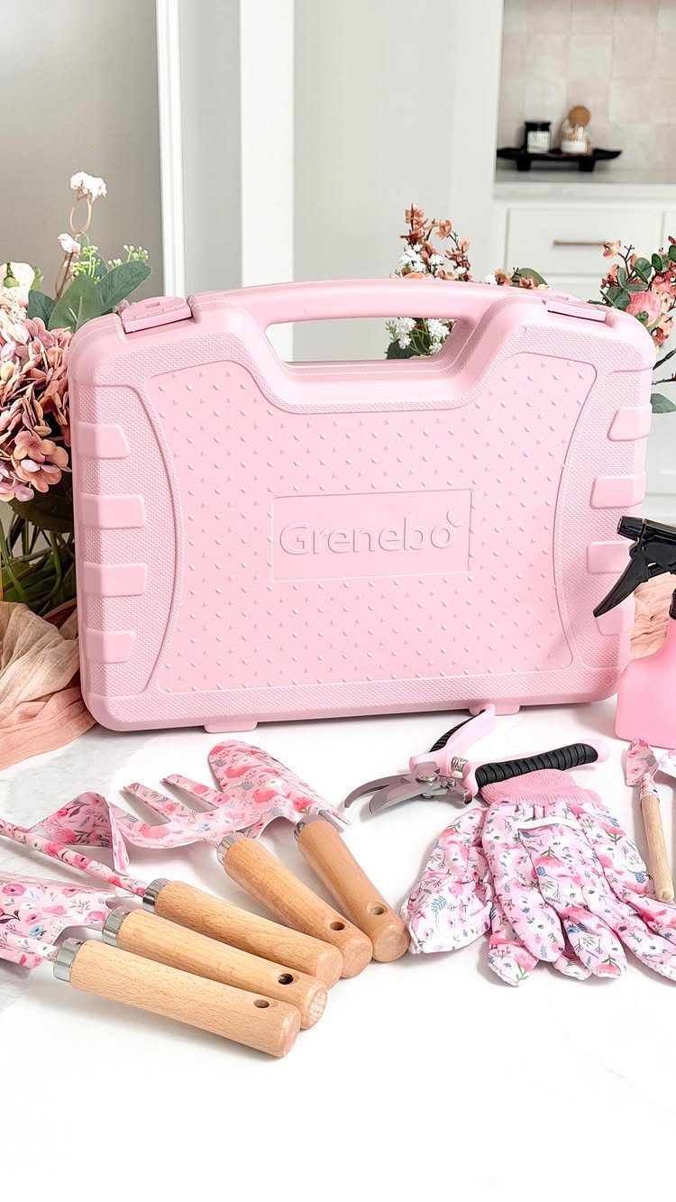 Pink gardening tool set with floral gloves and a matching carrying case.