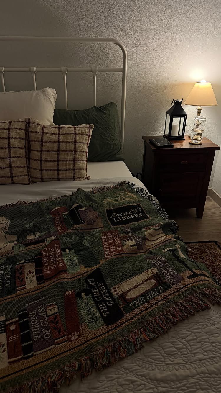 Personalized book-themed woven throw blanket draped over a bed in a cozy bedroom