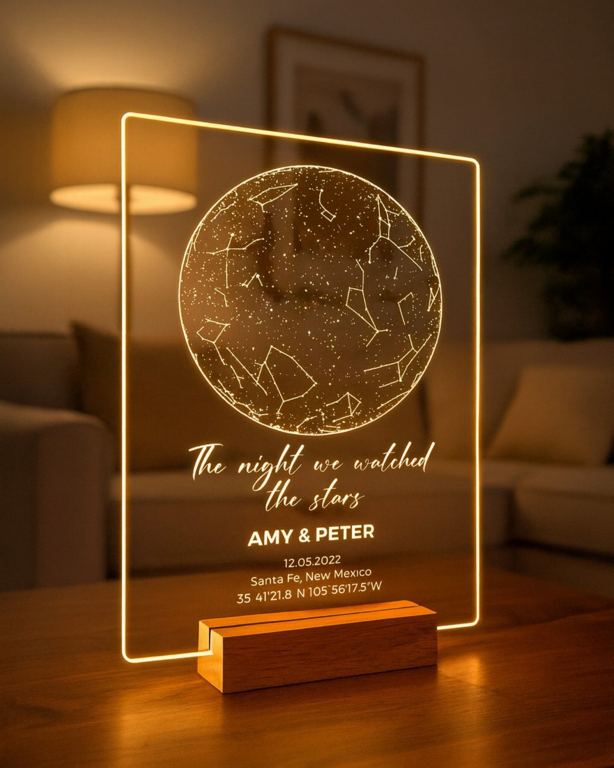 Illuminated acrylic star map plaque with personalized names and date on wooden base