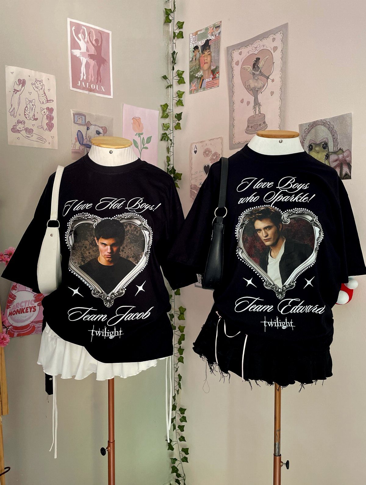 Two black Twilight themed t-shirts on mannequins featuring Team Jacob and Team Edward.