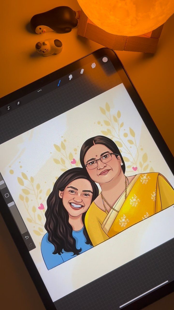 Digital tablet showing a cartoon illustration of two women in a family portrait.