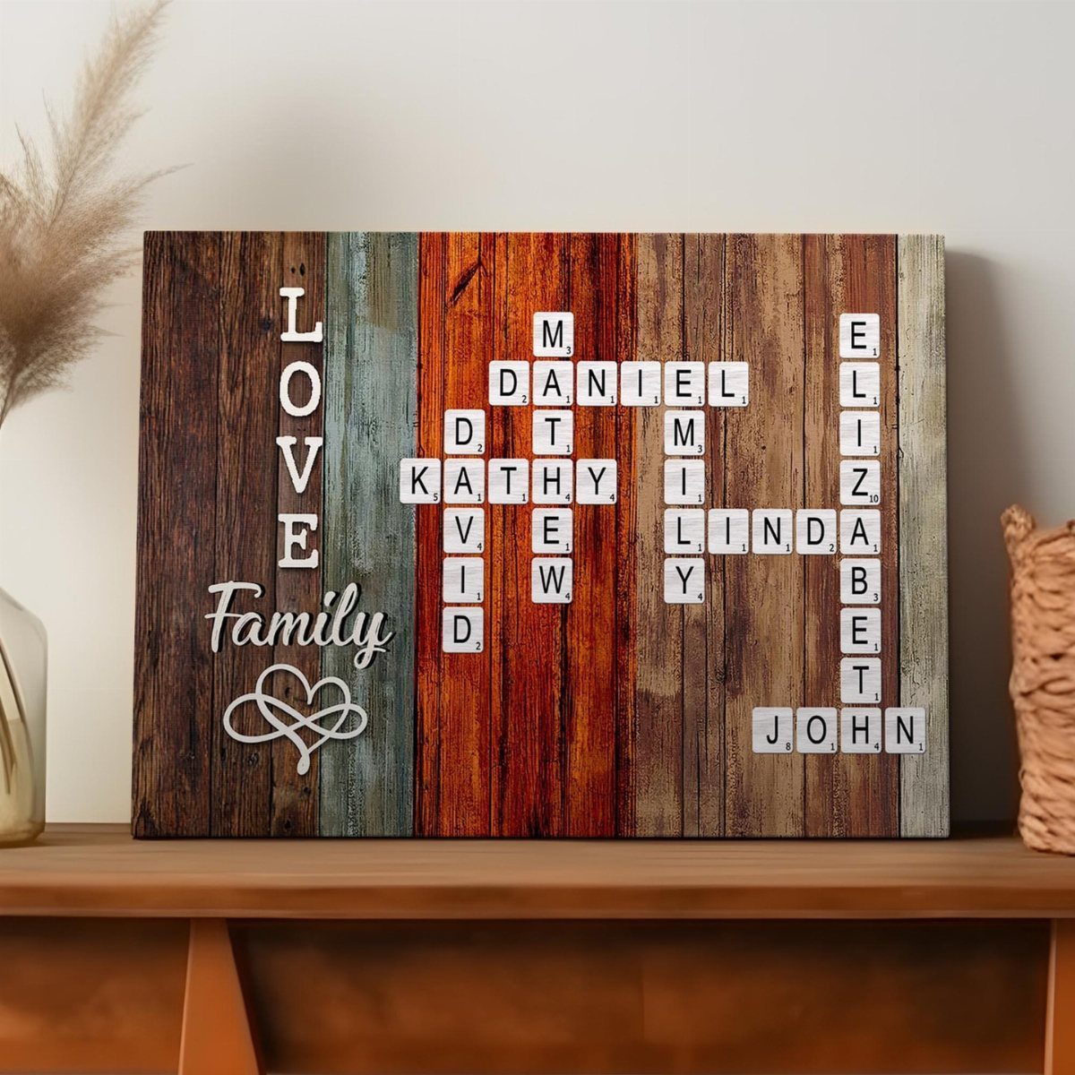 Wooden family name crossword sign with colorful planks resting on a brown table.
