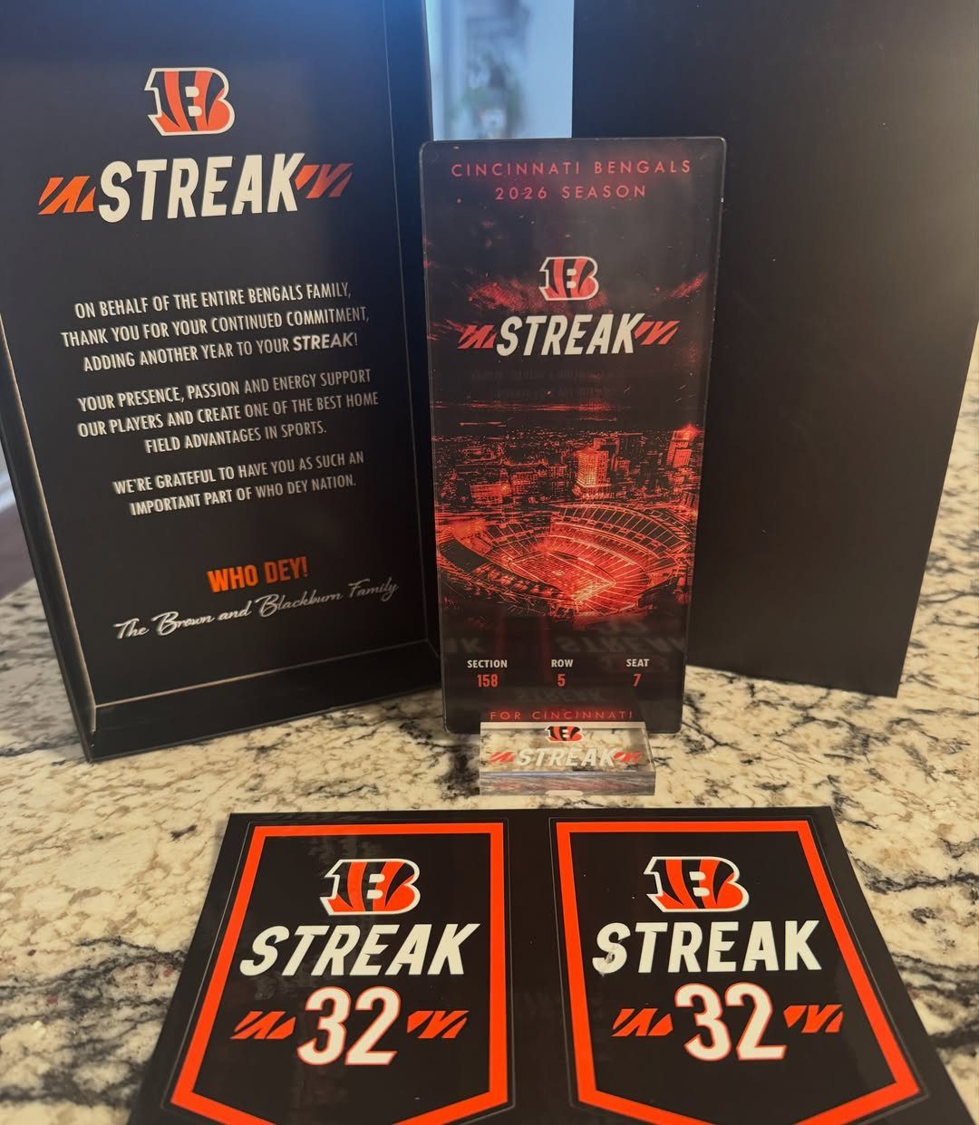 Cincinnati Bengals season tickets and membership package on a granite countertop.