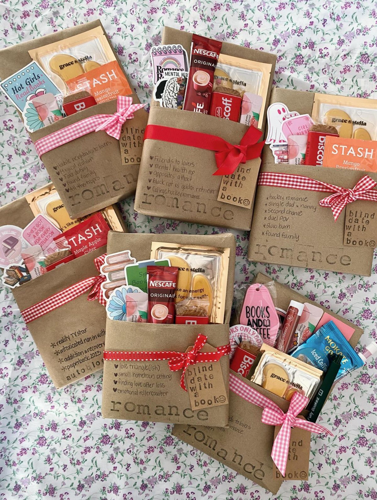 Wrapped books with ribbons and small gift treats on a floral background
