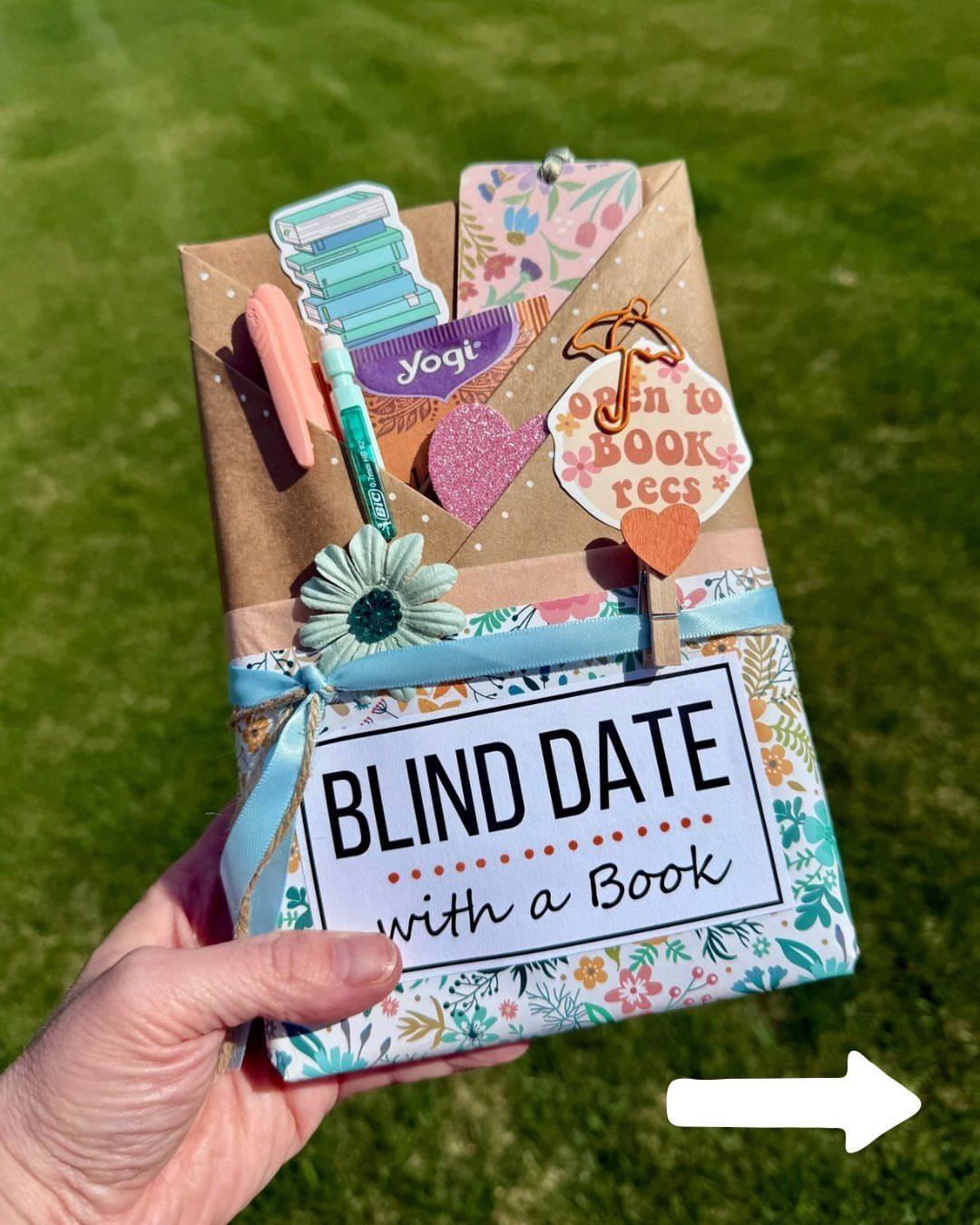 Wrapped book titled Blind Date with a Book decorated with stickers and ribbons.