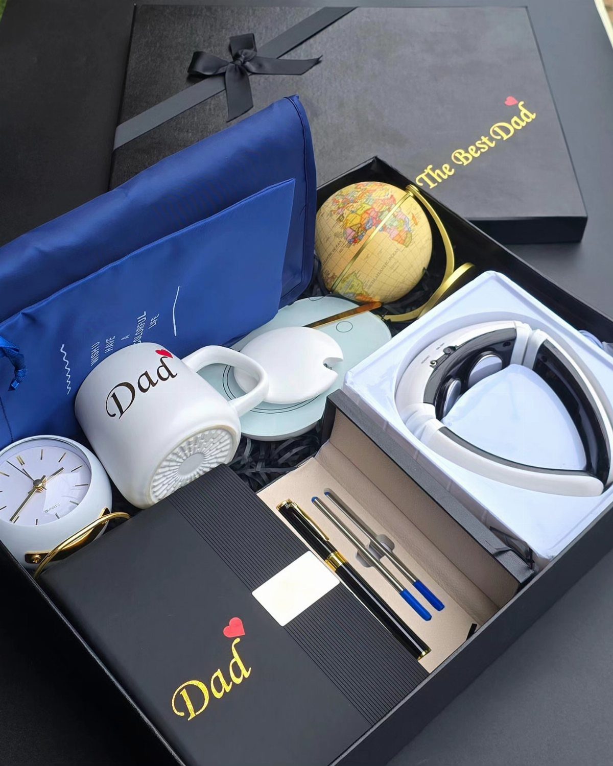 Gift box for dad containing a personalized mug, clock, globe, and headphones.