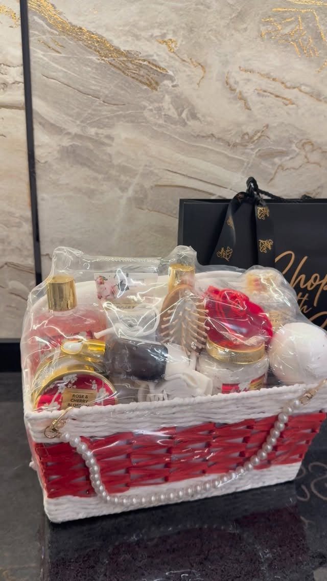 Spa gift set in a red and white basket wrapped in cellophane.