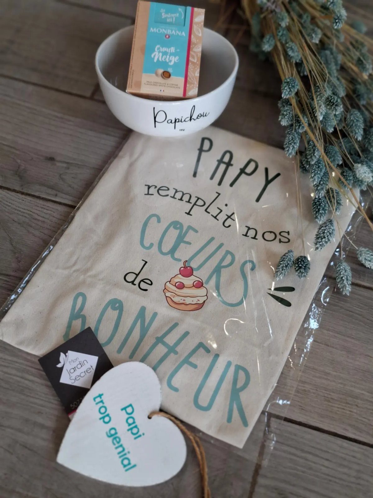 Gift set for a grandfather including a bowl, chocolates, and a printed bag.
