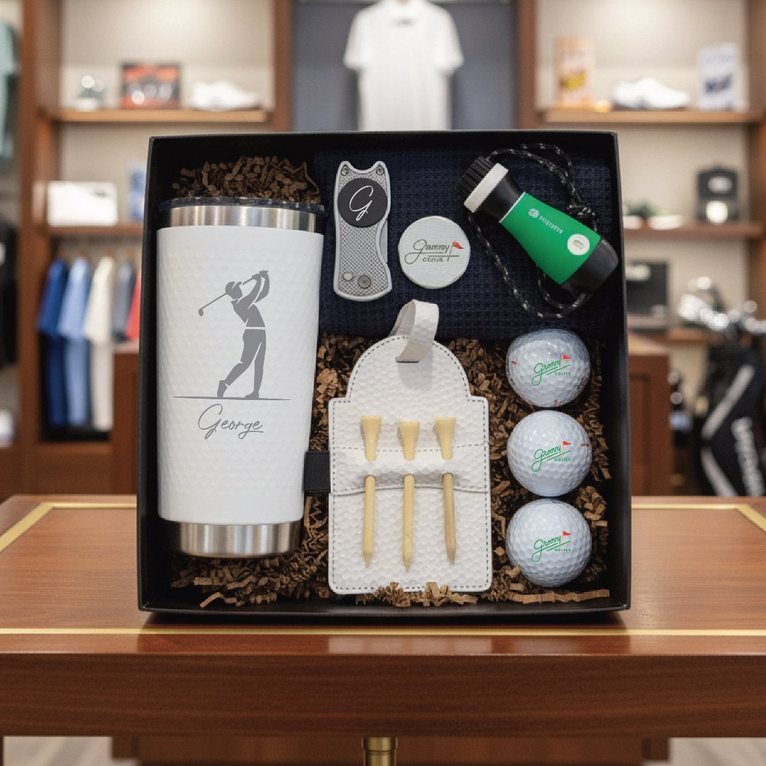 Golf gift set with personalized tumbler, golf balls, tees, and rangefinder in a box.
