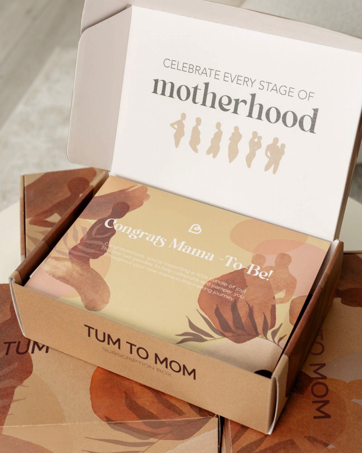 Open Tum to Mom subscription box with motherhood themed greeting cards inside.