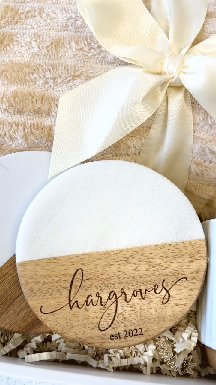 Marble and wood coaster engraved with Hargroves est 2022 in a gift box