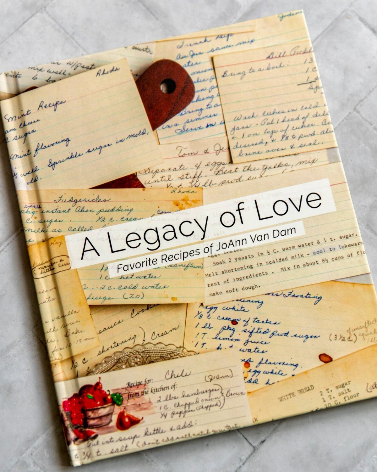 Family recipe book with a cover made of vintage handwritten recipe cards.