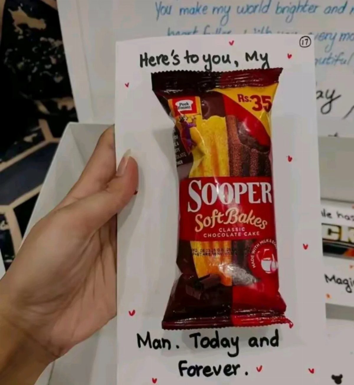 Handmade gift card with a chocolate cake snack and romantic handwritten message.