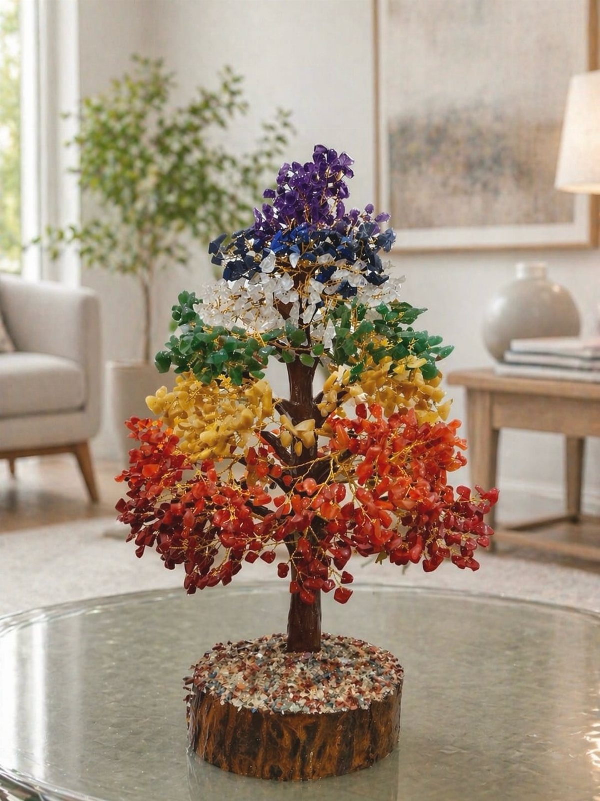 Gemstone tree of life with colorful crystals on a wooden base.