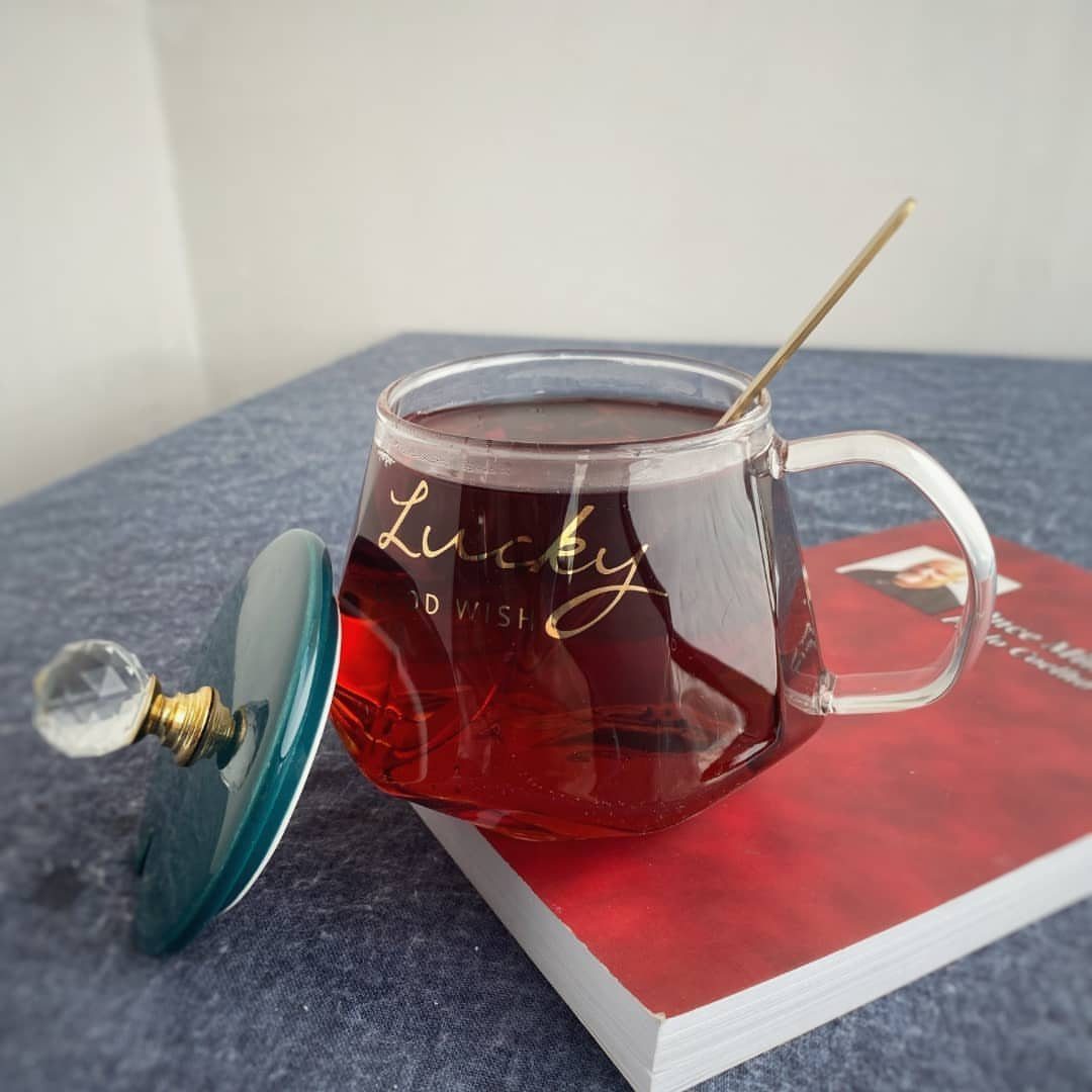 Glass tea mug with gold Lucky text and a crystal topped lid