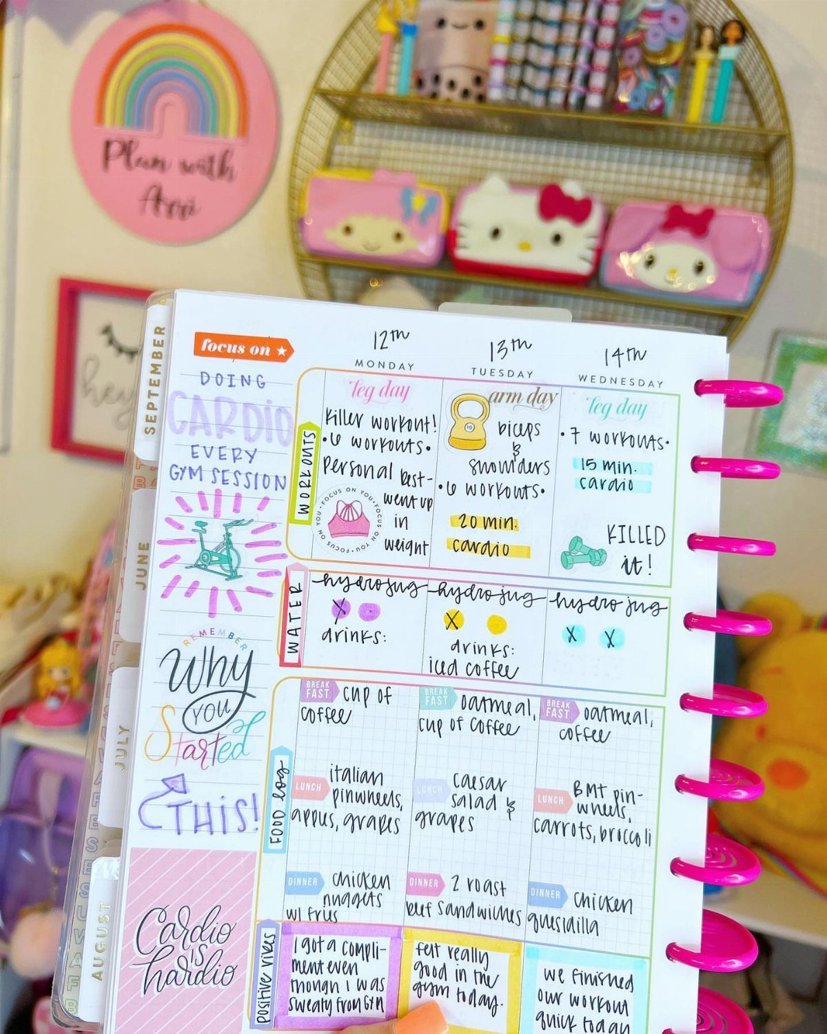 Handwritten wellness planner page with fitness goals, meal plans, and colorful stickers.