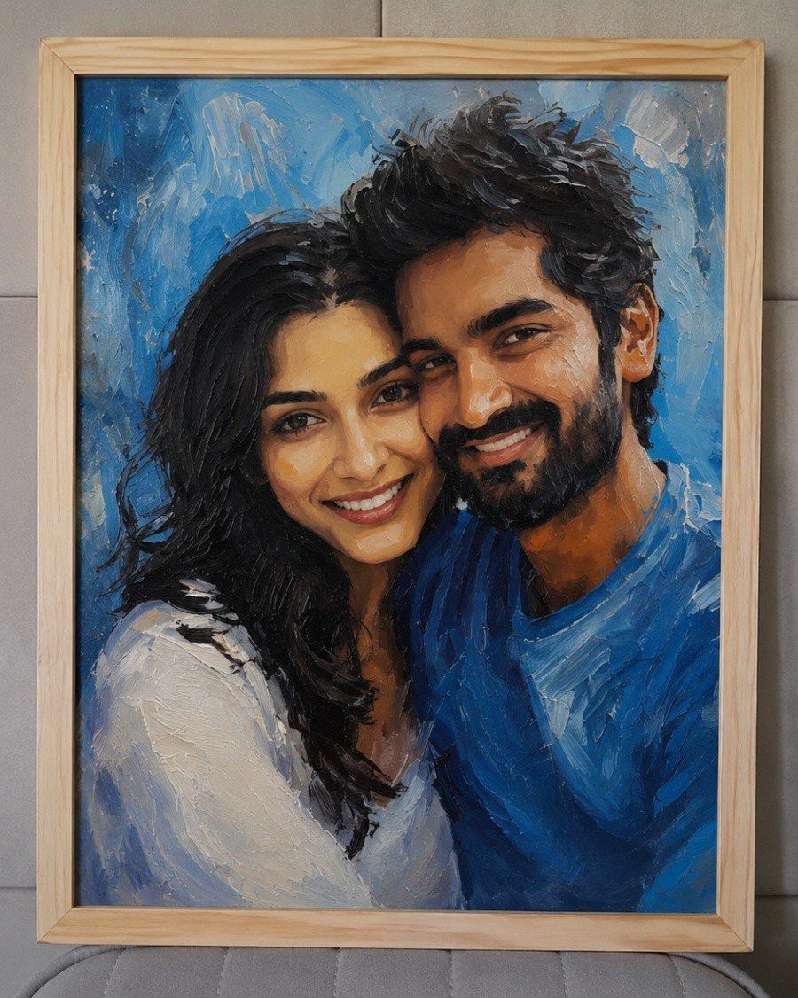 Oil painting of a smiling couple in a light wooden frame.