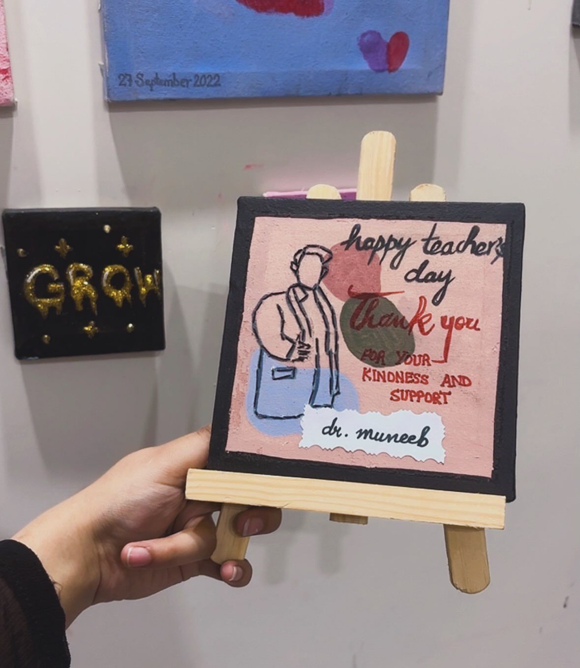 Handmade painting on a small easel for a male teacher's day gift.