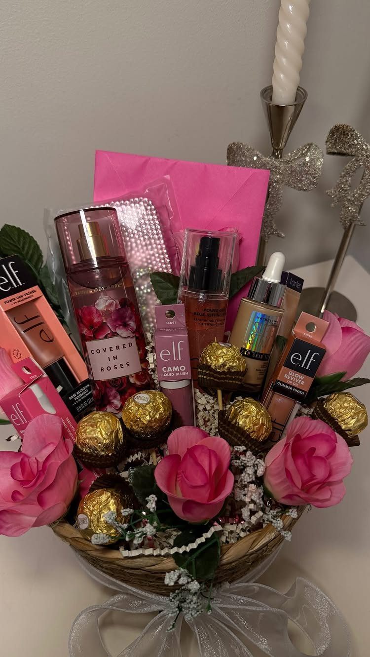 Gift basket with pink roses, chocolates, and e.l.f. beauty products for a woman.