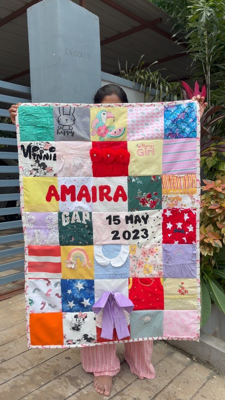 Patchwork quilt blanket with the name AMAIRA and date 15 MAY 2023
