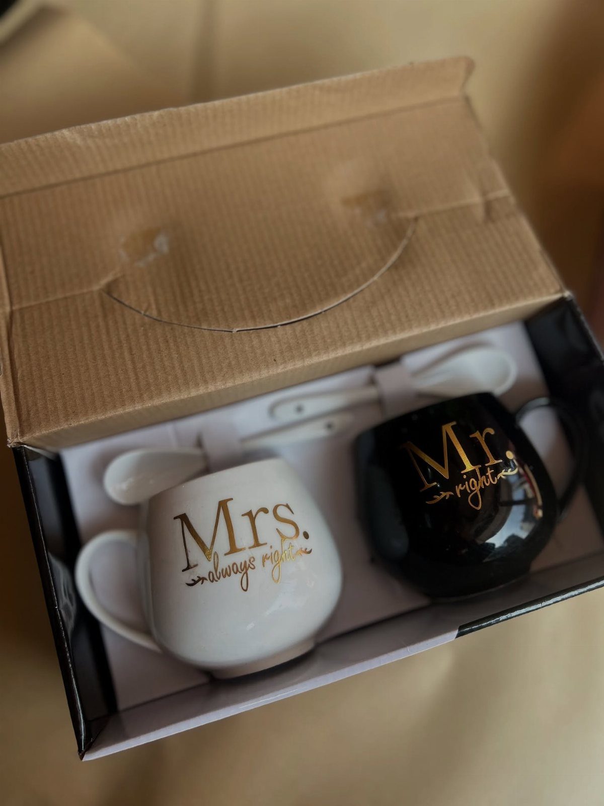 Two matching Mr. and Mrs. mugs with gold text in a gift box.