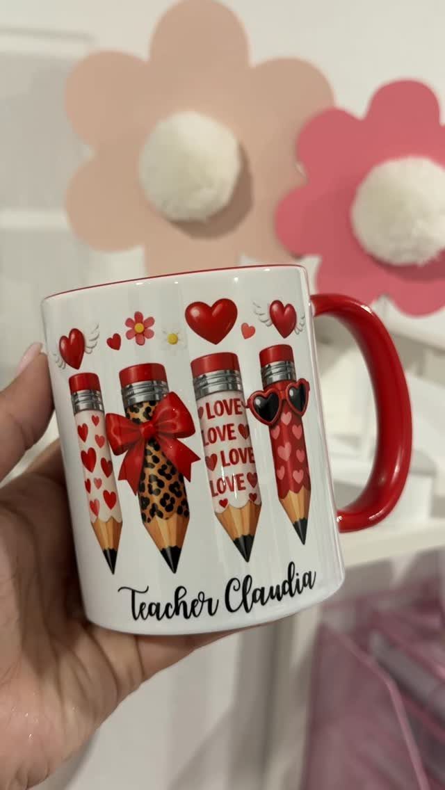 White ceramic mug with red handle featuring decorated pencils and Teacher Claudia text.