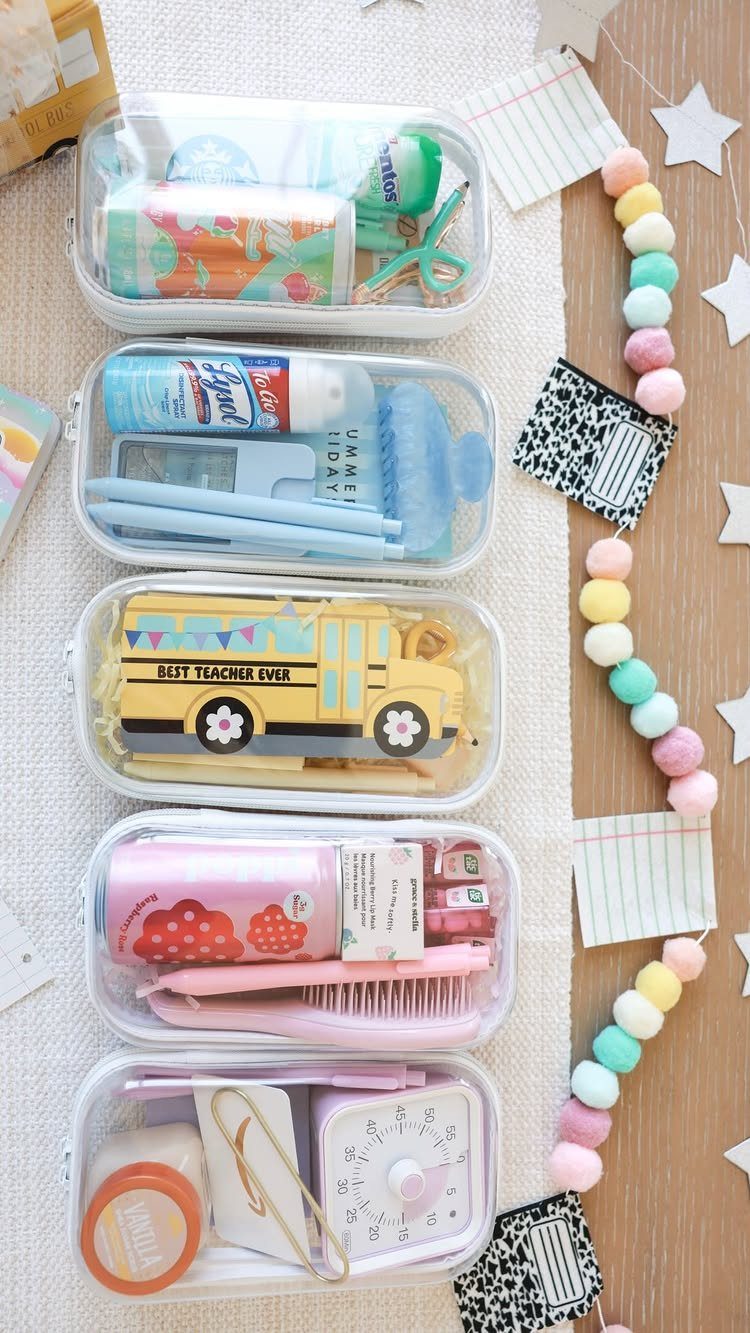 Five clear pouches filled with colorful teacher gift supplies and a school bus toy.