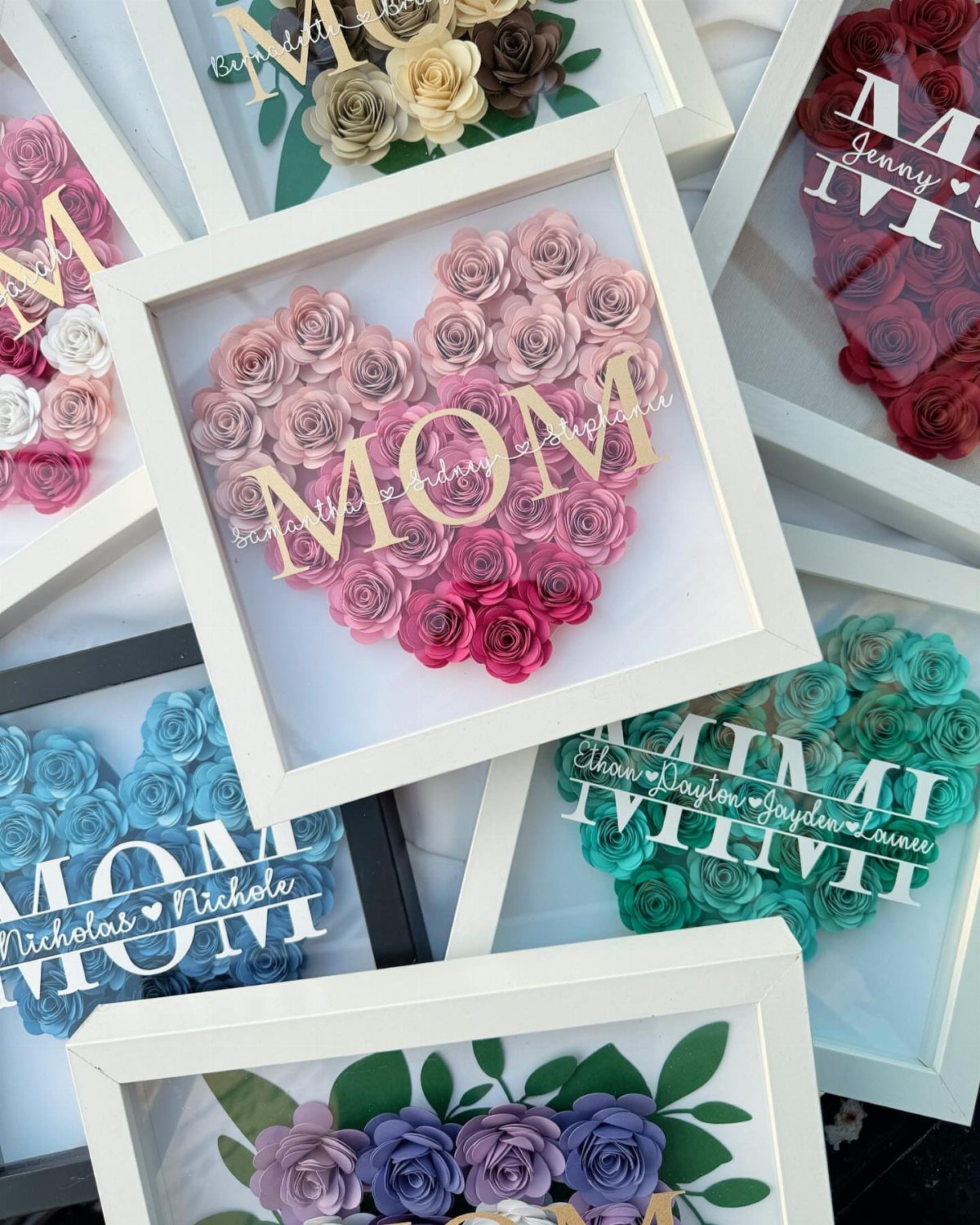 Heart-shaped paper rose arrangements in white frames with personalized MOM and MIMI text.