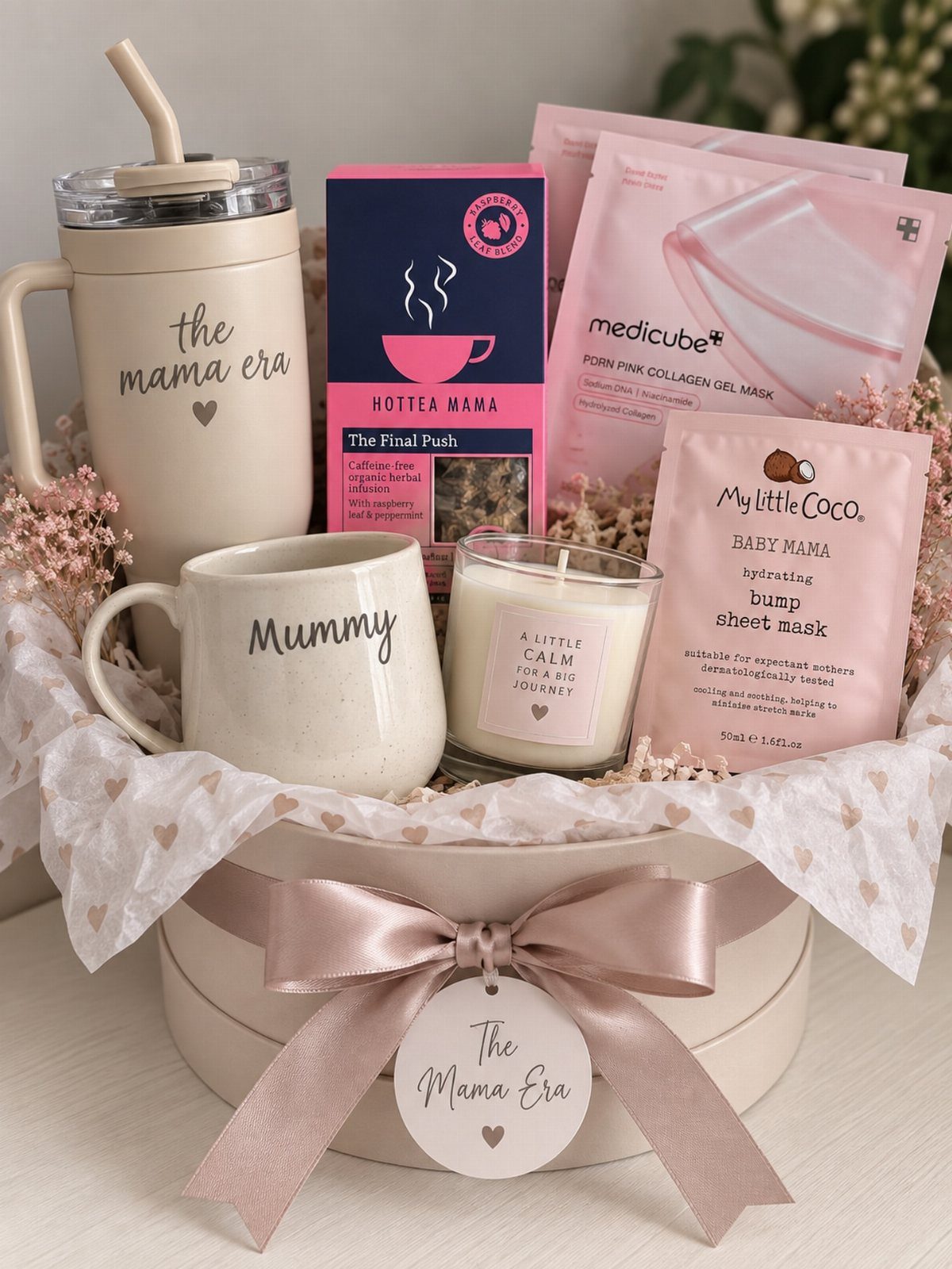 Gift basket with a Mummy mug, candle, tea, and facial masks in a box.