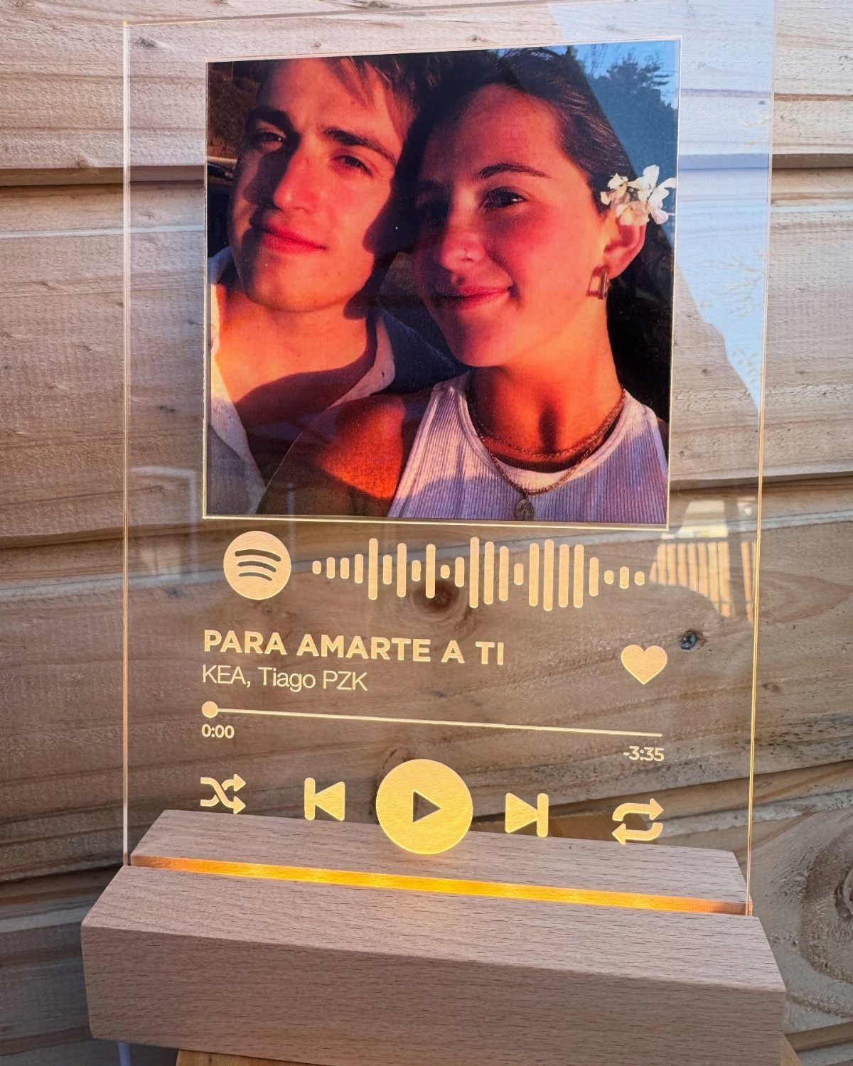 Personalized Spotify light box with a couple's photo and song playback interface.