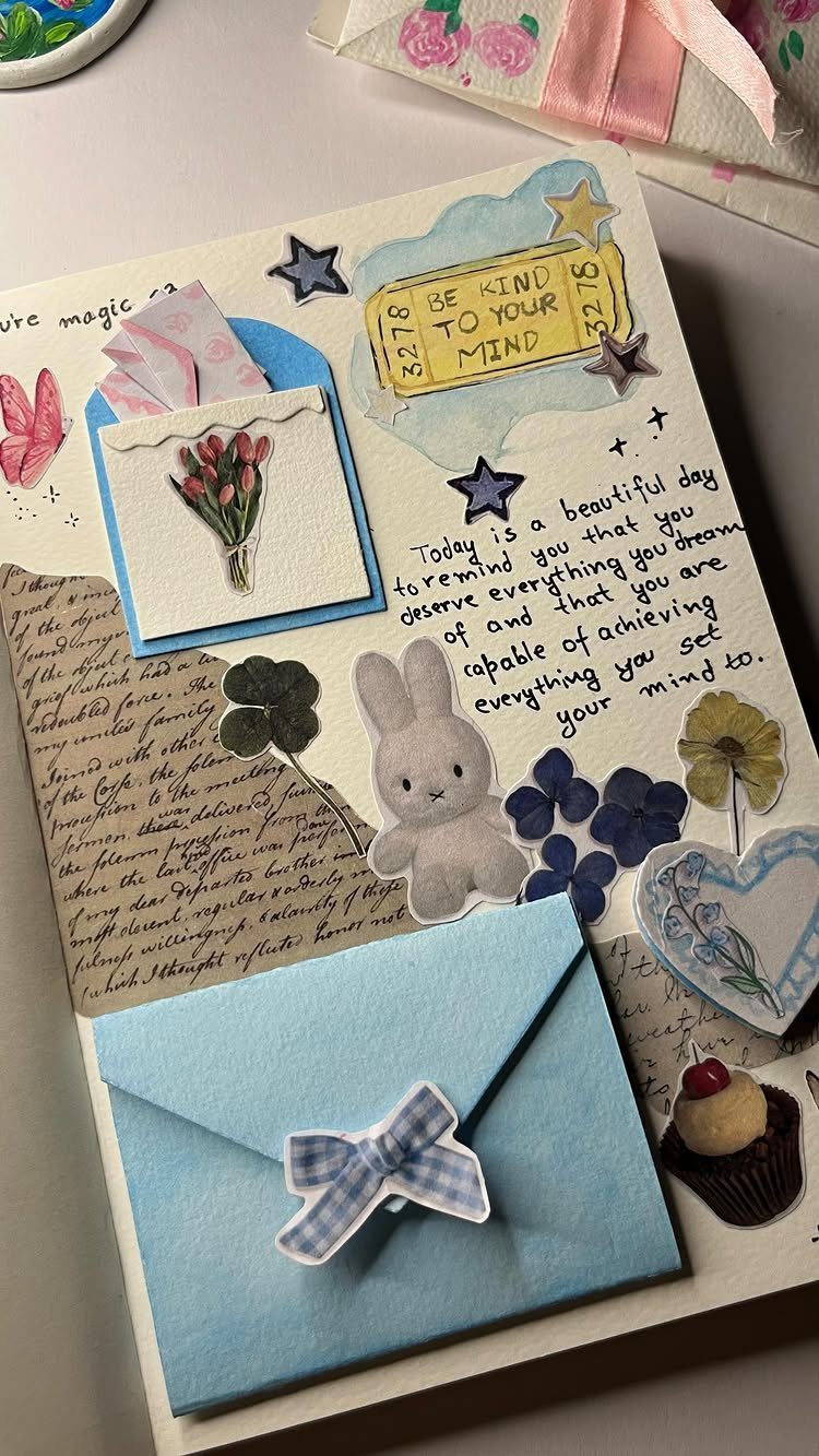 Decorated journal page with a blue envelope, bunny sticker, and positive affirmations.