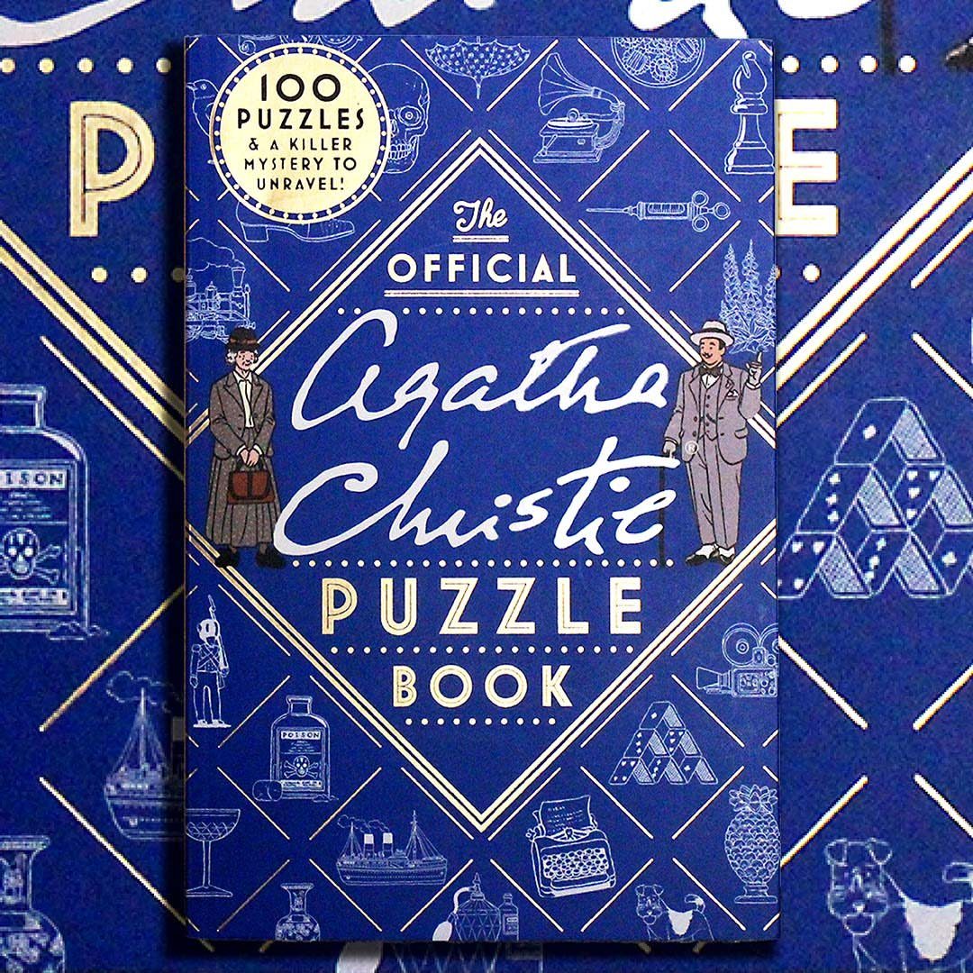 Agatha Christie Puzzle Book with blue cover and gold accents on patterned background