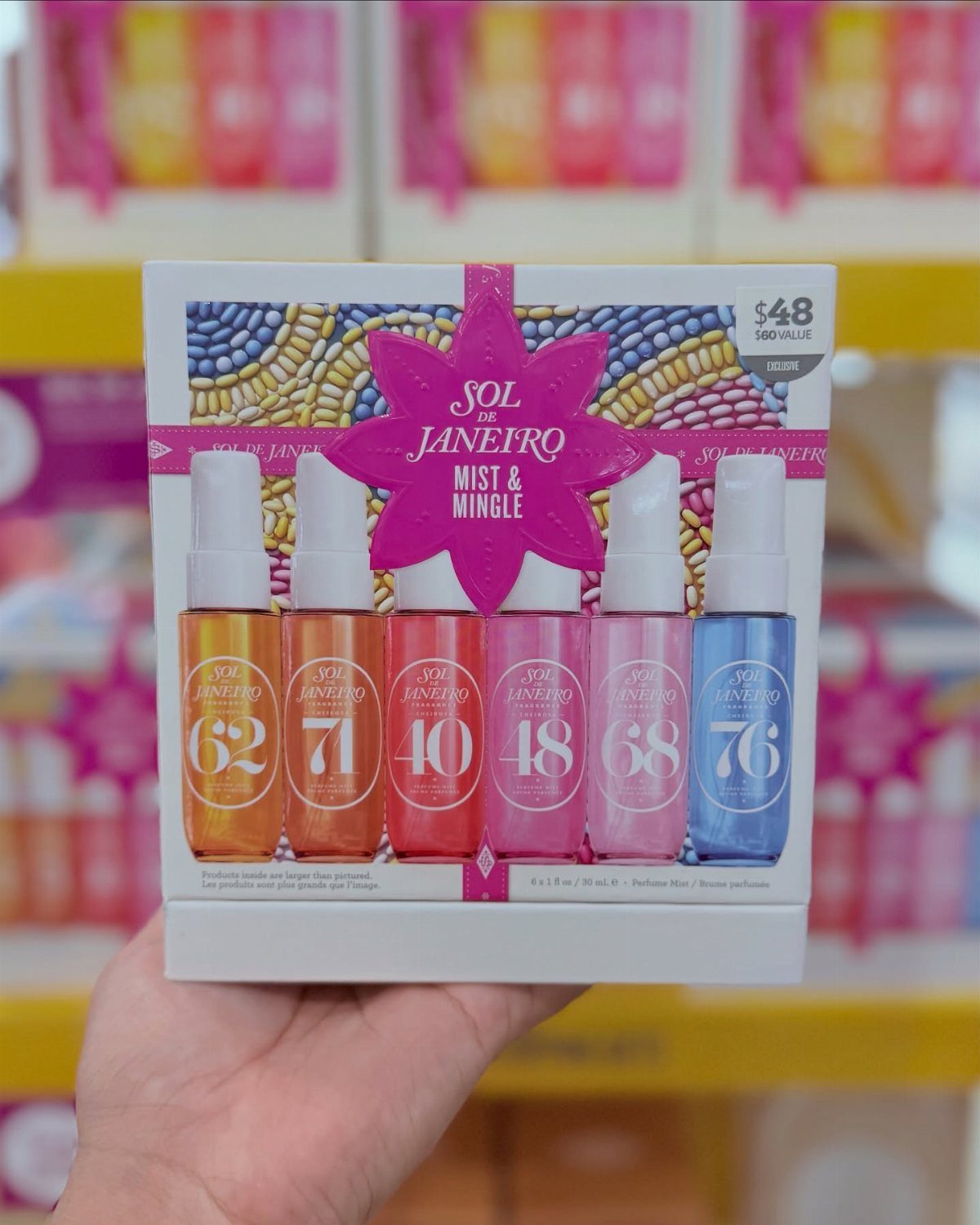 Sol de Janeiro Mist and Mingle fragrance gift set held in a hand.