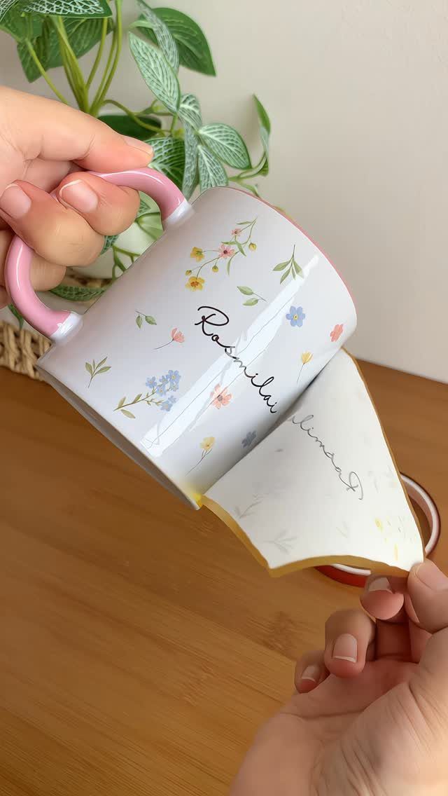 Floral ceramic mug with a pink handle and a matching removable coaster.