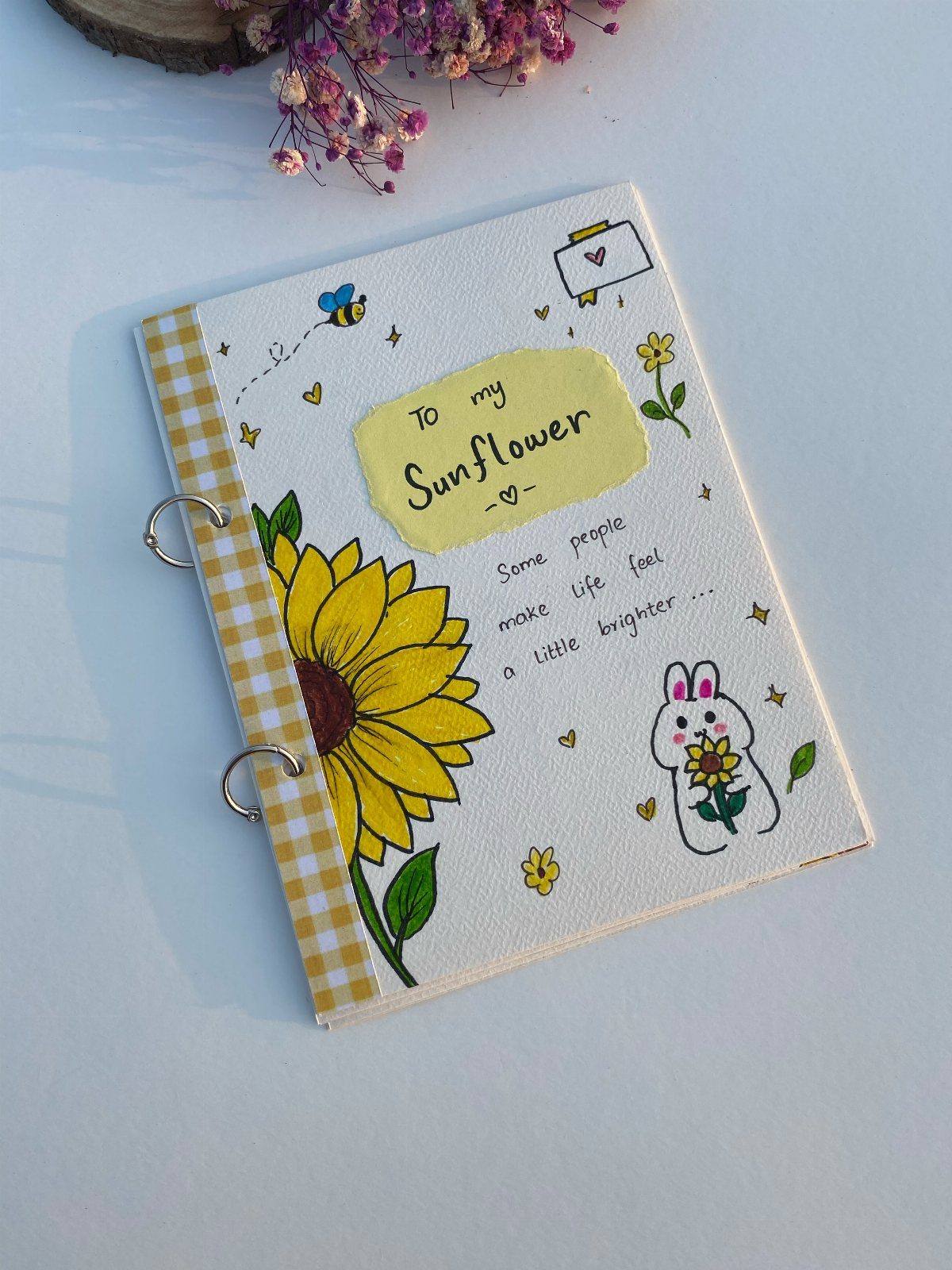 Hand-drawn journal cover with a sunflower, bunny, and the words To my Sunflower.