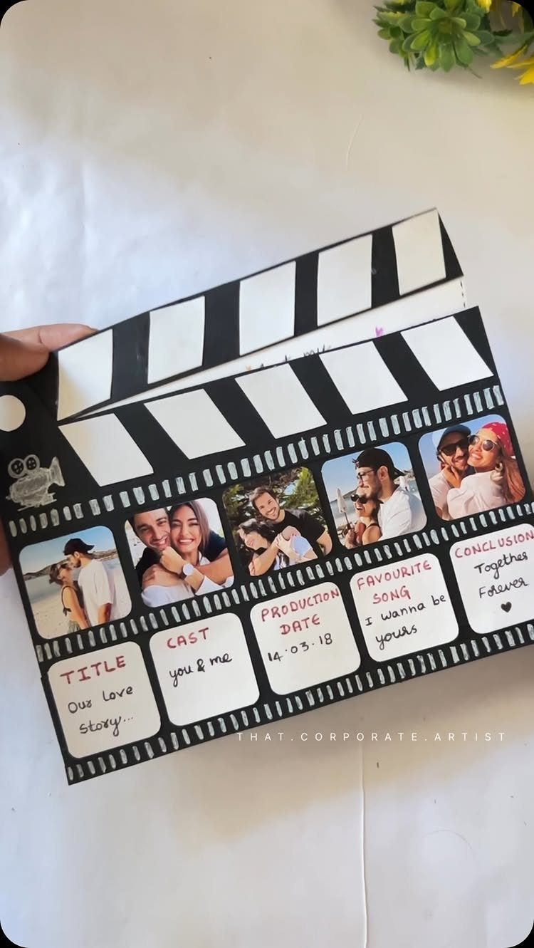 Handmade movie clapperboard card with couple photos and handwritten romantic details.