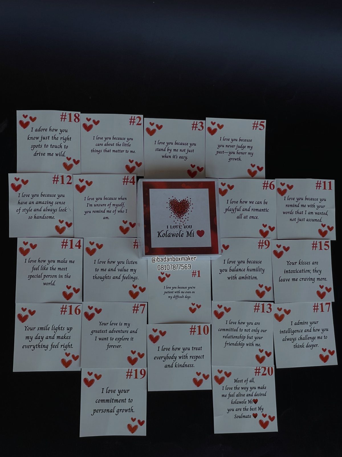Handwritten love notes with red hearts arranged in a grid on black background.