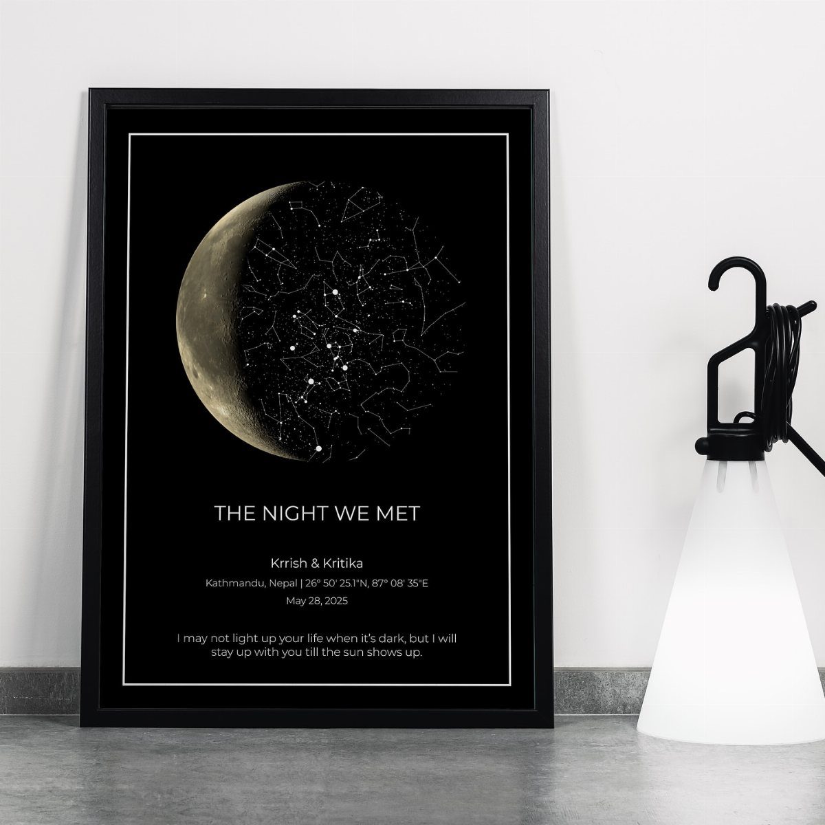 Framed star map poster with a crescent moon and romantic text on white wall