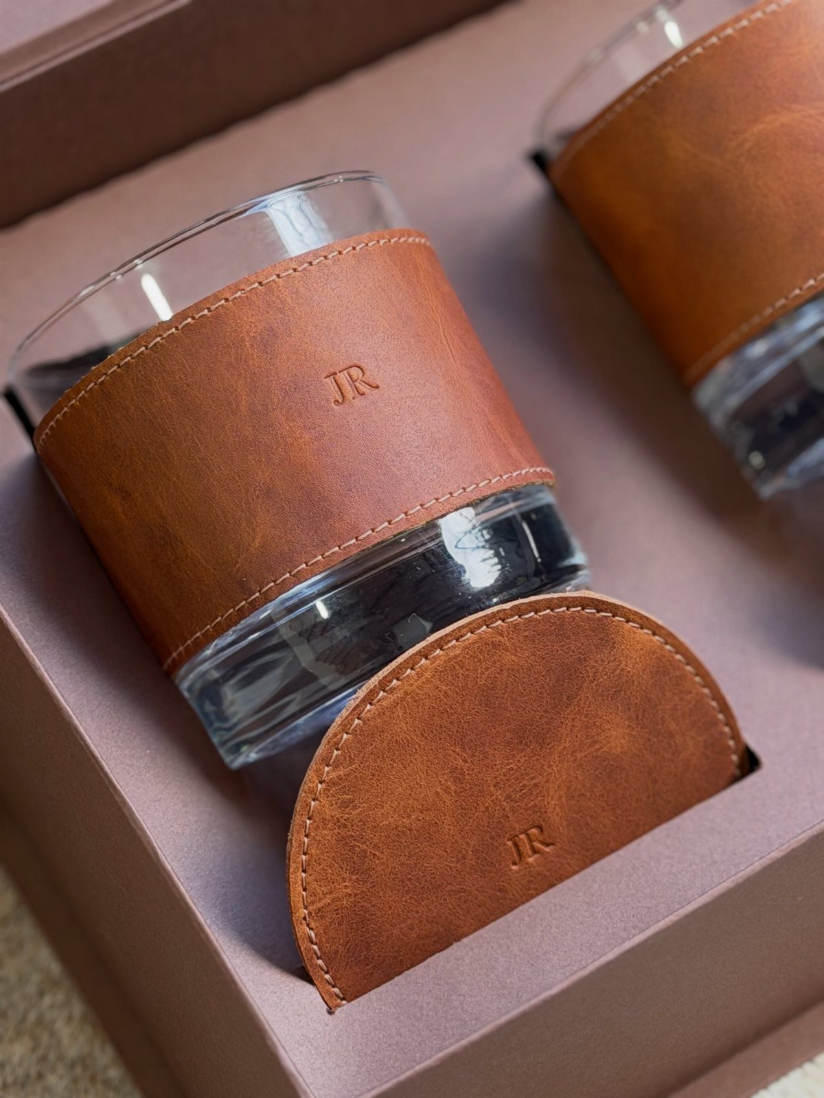 Leather wrapped rocks glasses with embossed initials in a brown gift box