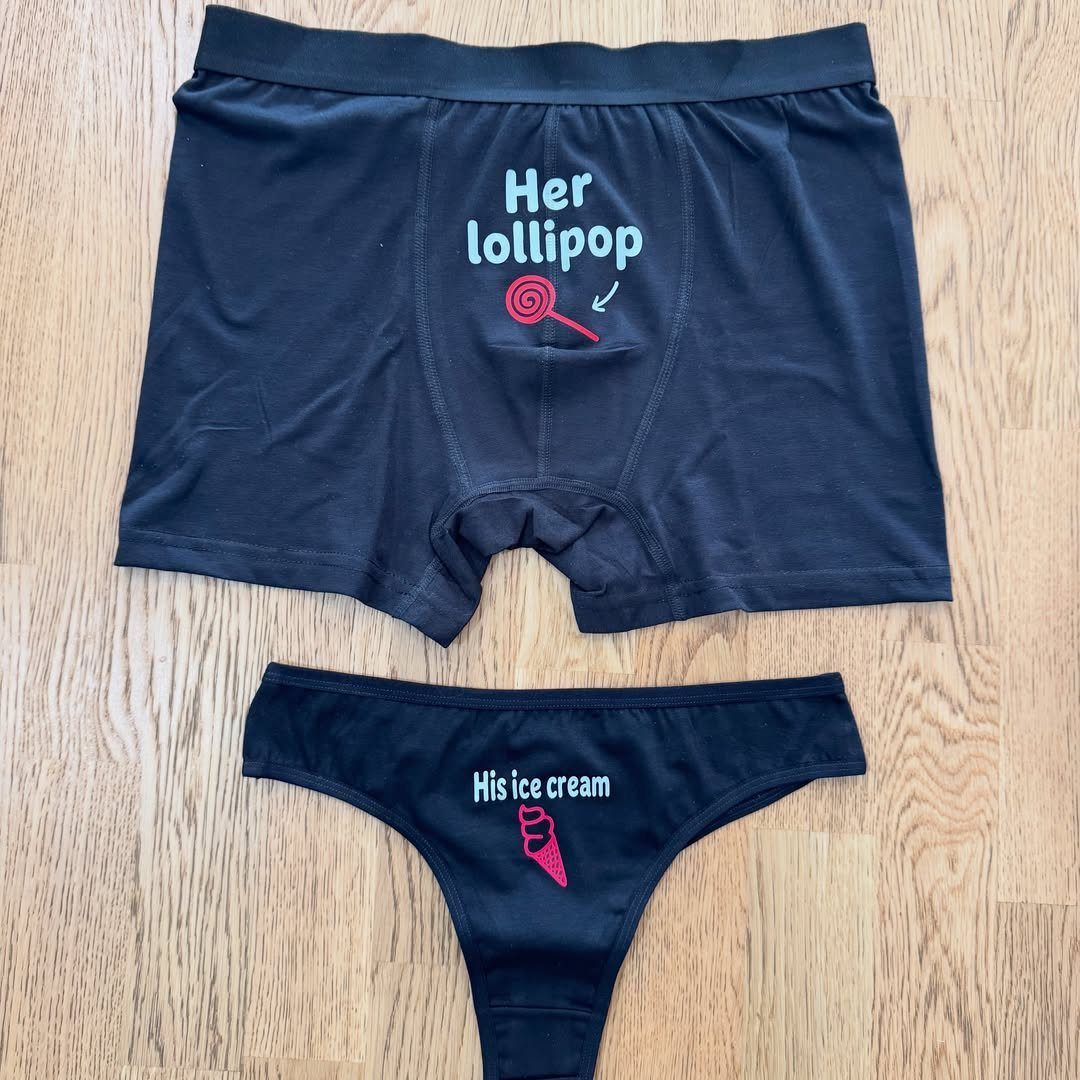 Black matching underwear set with lollipop and ice cream graphics on wooden floor